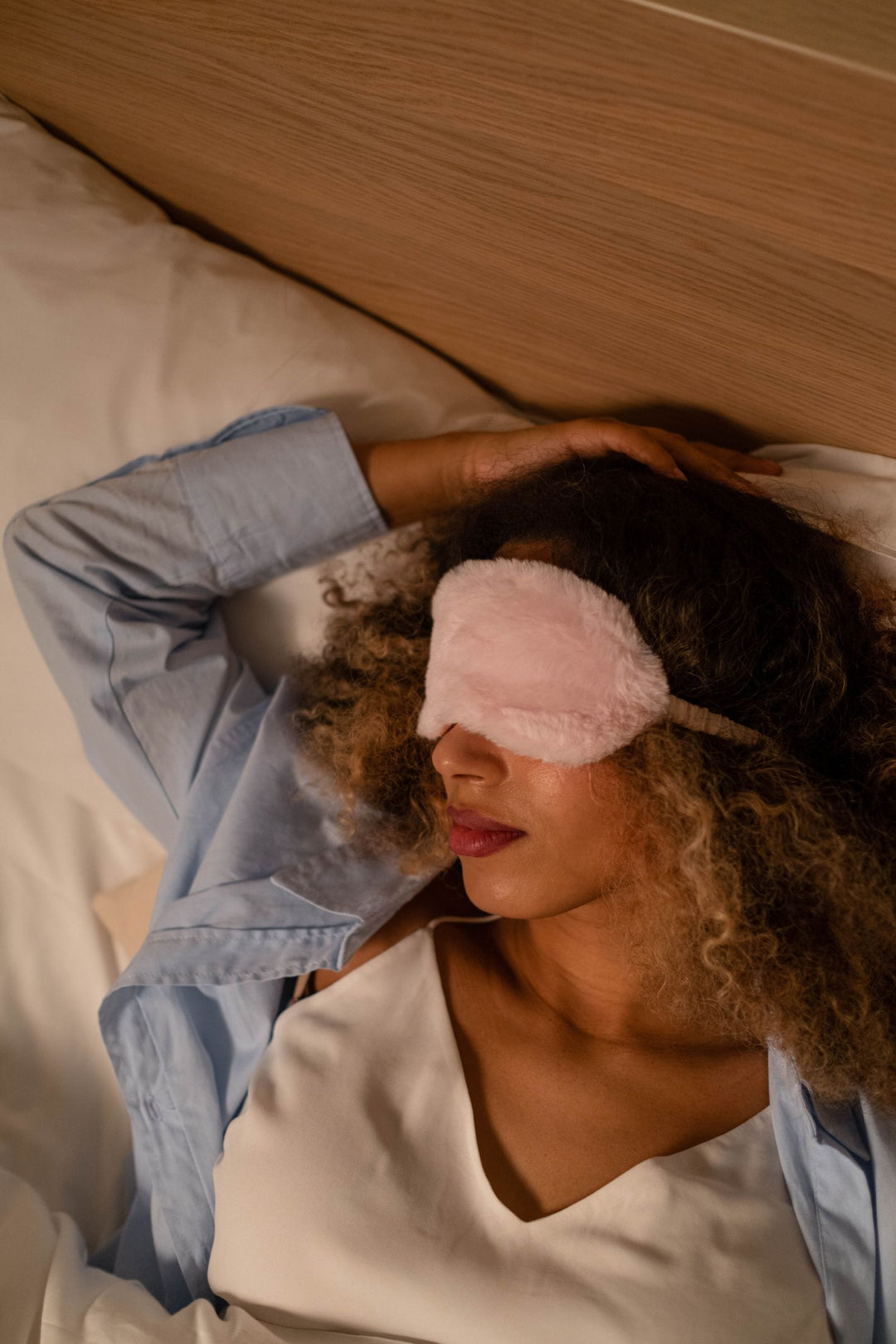 Woman resting with a sleep mask
